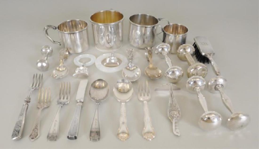 Twenty-Three Sterling Children's Items: American, 20th century, including: Four mugs, all with monogram or name (Largest in good condition; one Damask Rose, Heirloom, with numerous dents to base; other two with small dents)---Five dumb bell