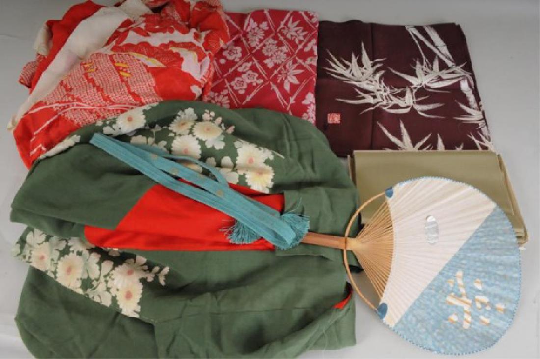 Lot of Japanese Textiles: Two kimonos, one red and white floral design with embroidered white collar, one green with floral pattern to bottom of front panels---52"L woven teal belt---Long green 8 3/4"W obi or sash---Paper and 