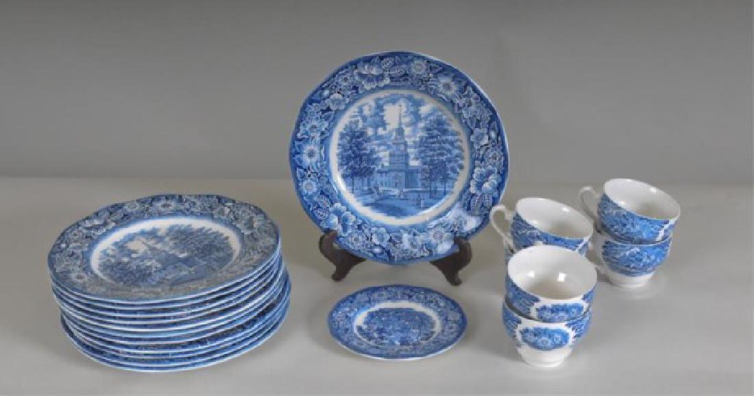 12 Liberty Blue English Transferware Plates: Blue and white transferware "Featuring Historic Colonial Scenes Printed on Staffordshire Ironstone"; twelve 9 3/4" dinner plates, one bread and butter plate, six cups (Ref. 42)