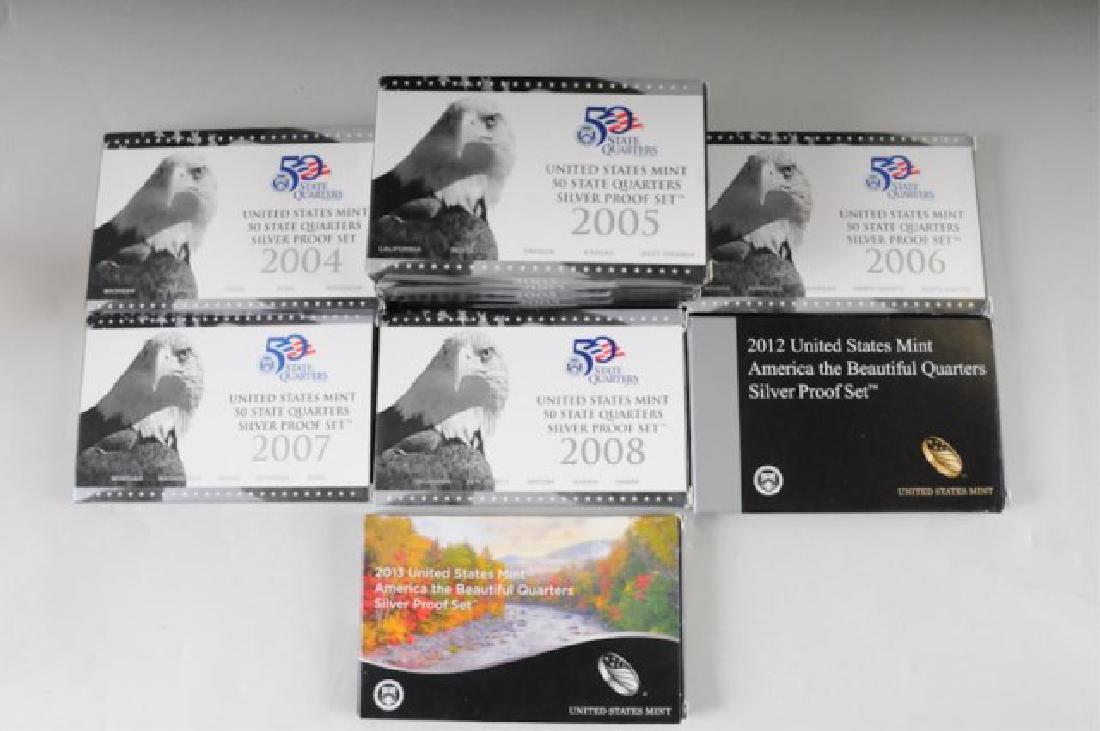 12 United States Mint Silver Quarter Proof Sets: "Unites States Mint 50 State Quarters Silver Proof Set": 2004 (x2), 2005 (x5), 2006 (x1), 2007 (x1), 2008 (1). "United States Mint America the Beautiful Quarters Silver Proof Set": 2012 (x1), 2013 (x1