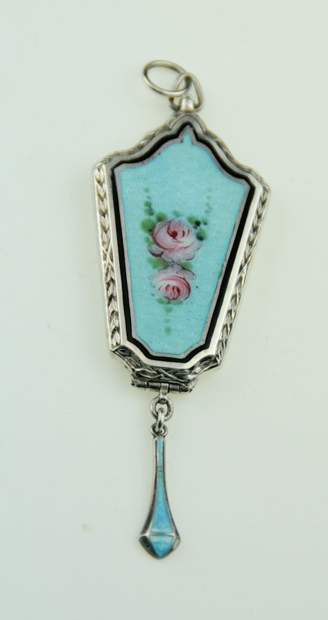 Art Deco Guilloche and Sterling Silver Locket: Sterling silver and guilloche enamel pendant locket, blue guilloche enamel hinged locket with hand painted floral decoration, tapered drop pendant with blue guilloche enamel, interior marked "Sterling