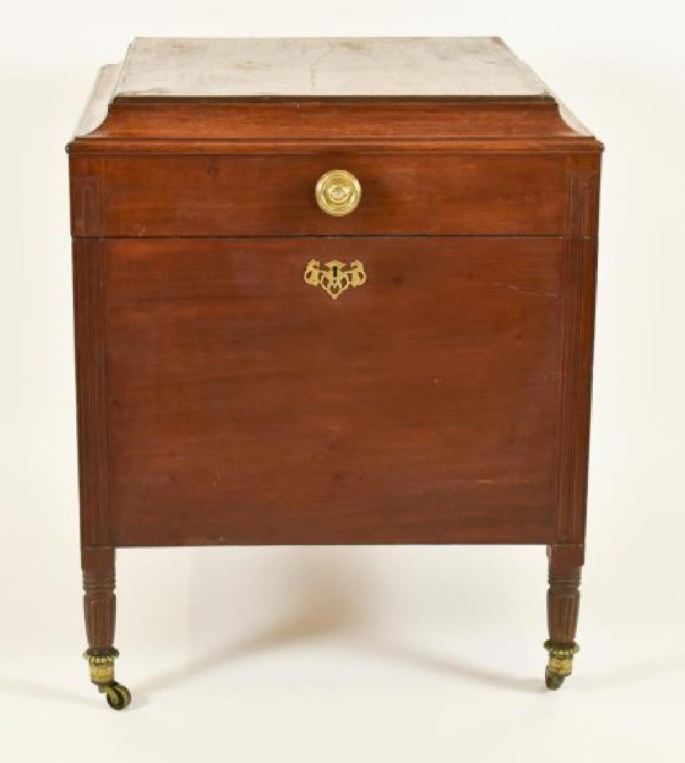 c. 1820 Sheraton Mahogany Inlaid Cellarette: Square form, inlaid hinged lid opens to dovetailed fitted interior having 16 bottle compartments, brass knob and escutcheon, reeded legs with original brass casters; 25" x 25", 31"H; good condition ov