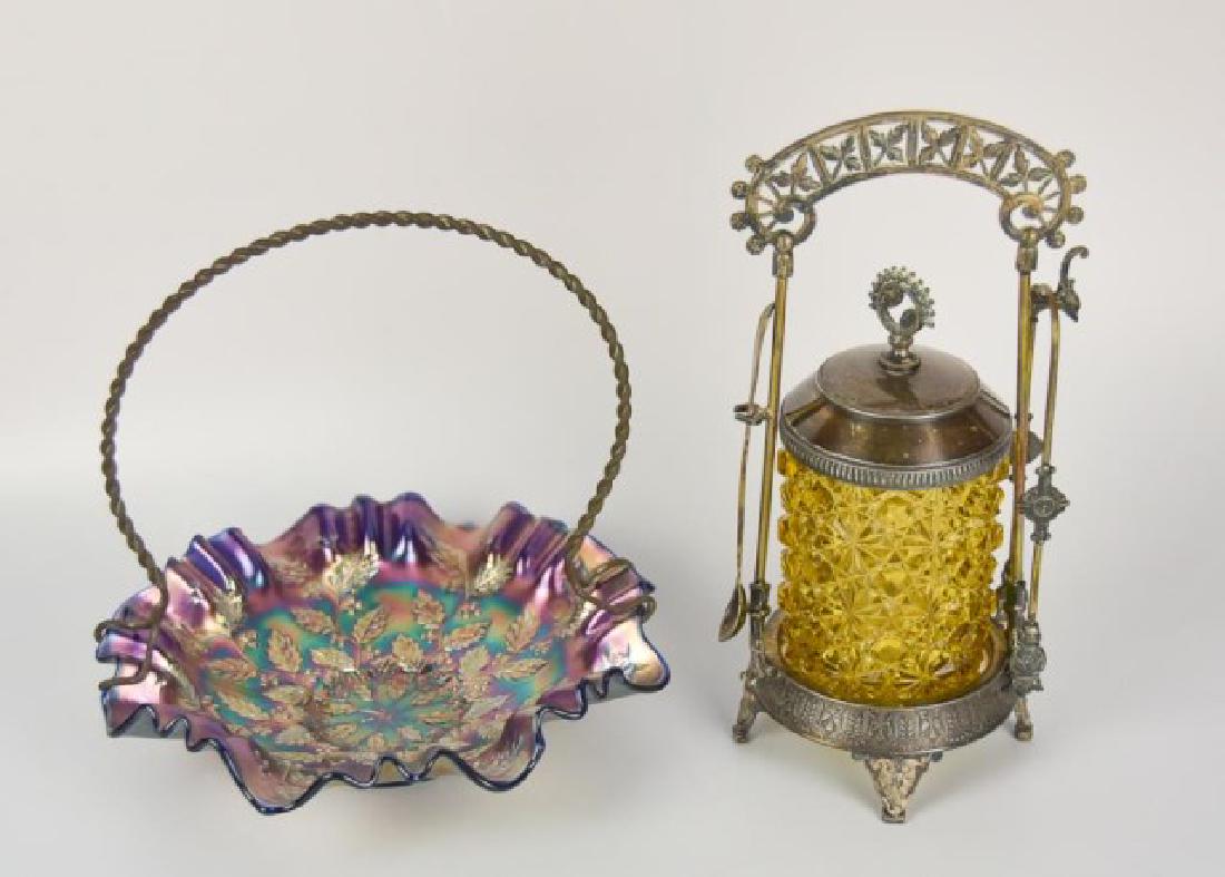 Amber Pickle Caster & Fenton Carnival Glass Bowl: 1. EAPG amber daisy and button pickle caster, Meriden footed silver plate stand with openwork crest, tongs; Rogers, Smith & Co. spoon; 10 1/2"H; good condition---2. Fenton "Holly" carnival glass foote