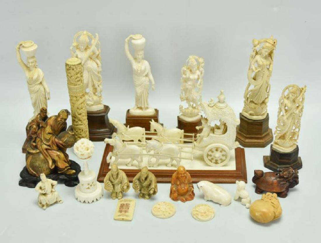 Lot of Chinese & Oriental Decorative Items: 21 molded composite decorative items including a figural chariot group, various statues on wooden bases, puzzle ball on stand, netsuke, etc.
