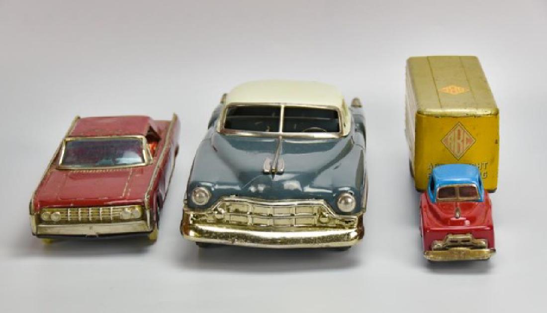 Lot of Four: Japanese Tin Litho Toys: 1. Tin litho Lite-O-Wheel battery operated Lincoln Continental, burgundy with four doors, lithographed interior, marked "Made in Japan"; 10 1/2"L; overall scattered losses to paint, small dents, missi