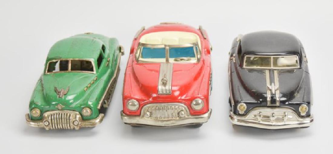 Lot of 3: Japanese Tin Litho Friction Toy Cars: c. 1950s: 1. Green Buick four-door sedan, rear suicide doors, side chrome trim with cut-out star design, hubcaps marked "Buick"; 10 1/2"L; hood ornament with loss and repair, scattered overall losses 