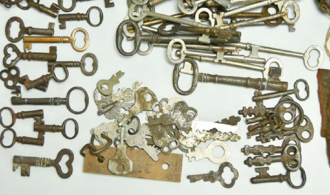 Lot of Over 160 Keys: Includes: Two double end clock keys; six brass and 30+ metal door keys; 40+ cabinet and box keys; 25+ flat keys; 60+ miscellaneous keys; miscellaneous key holders (Ref. 333)