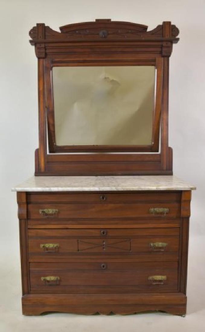 19th C. Marble Top Walnut Dresser: Swivel frame with mirror, rectangular marble top over three long drawers, paneled sides; 39 1/2"W, 18 1/2"D, 73"H; light stains to marble, part of back panel missing, case back stabilized with metal a