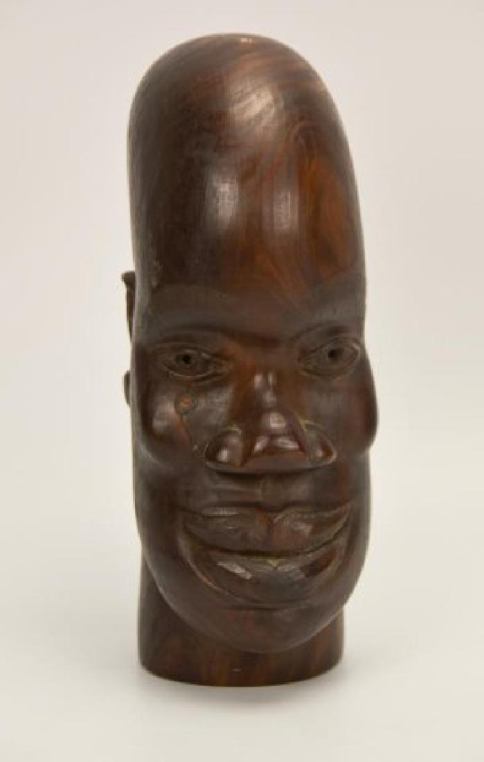 Signed David S. Miller, Jamaica, Wood Carving: Folk art wood carving of ethnic head, signed on base "D. S. Miller / 8 Bray St. / Kingston / Jamaica / B.W.I."; 8 3/4"H---Miller's carvings were part of an exhibit "Jamaican Art: 1922-1982" organized