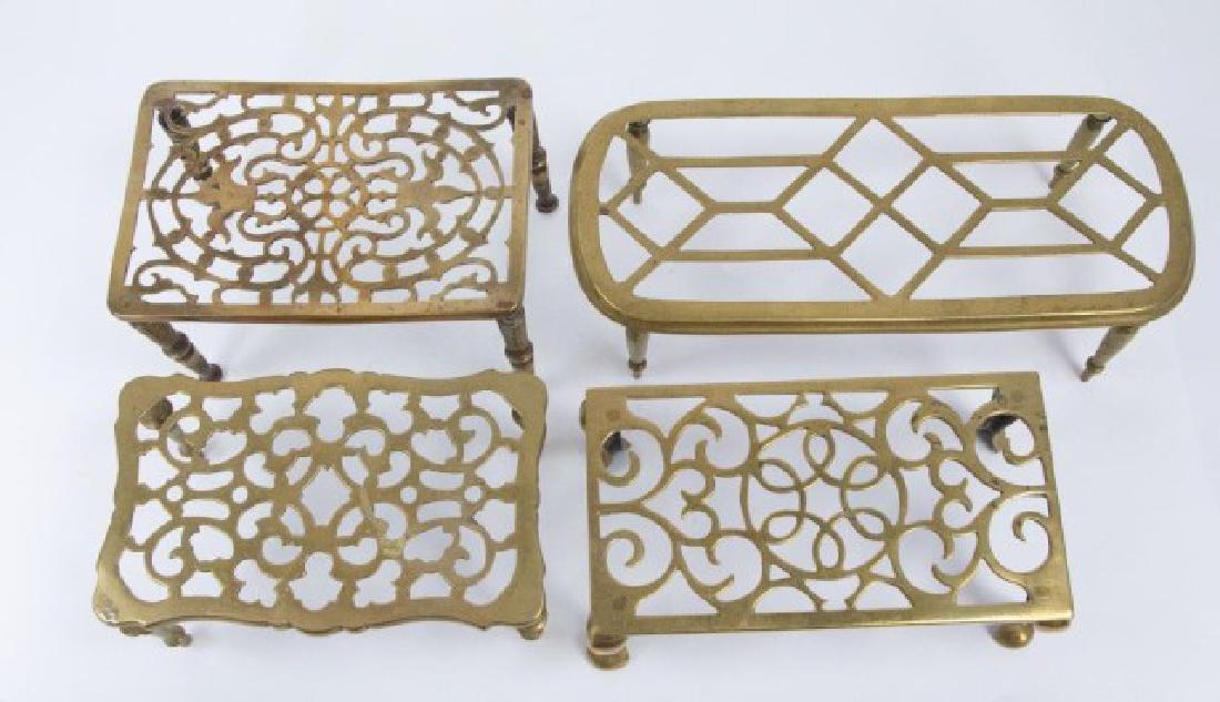 Five 19th C. Brass Trivets or Kettle Stands: All with decorative pierced tops; one oval 14 1/2" x 6 1/4", 4 1/2"H; one round 7 3/4" dia., 1 1/8"H; three rectangular 10" x 5 1/2", 3 5/8"H; 6 1/4" x 9 1/4", 5"H; 9 1/2" x 6", 4 1/8"H