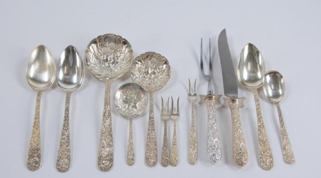 12 S. Kirk & Son Repousse Sterling Serving Pcs.: 12 pieces, including: 9 1/8"L shell berry/casserole spoon---7 1/2"L shell berry spoon---Three 8 3/8"L serving spoons---5 1/8" bonbon spoon---Two-piece steak carving set---Two 4 1/2"L lemon forks---6"L
