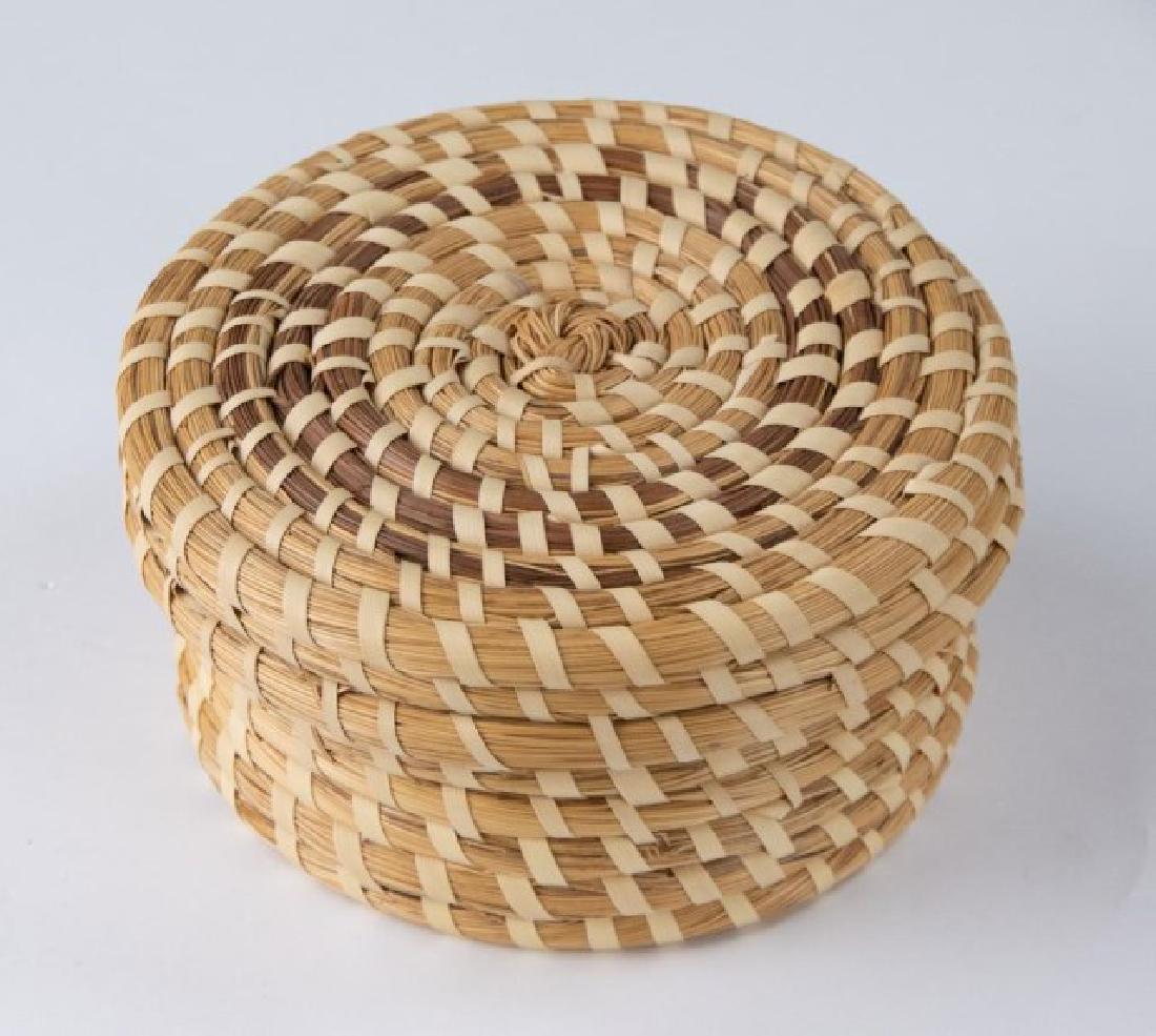 Gullah Sweetgrass Lidded Basket: Round basket with lid, traditional coiled style, 20th century; 6 1/2" dia., 3"H; good estate condition, minor breaks to vertical binding strips (Ref. 9)