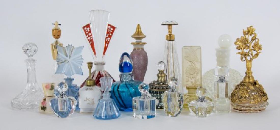 Grouping of 19 Perfume Bottles: Early to late 20th century: 1. Irice Czechoslovakian blue crystal perfume bottle with matching stopper, original foil Irice label on base; 5 1/4"H; flea bites to edges, no dauber---2. Czech yellow cry