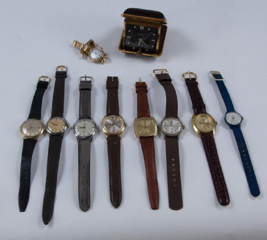 Nine Wristwatches & One Travel Alarm Clock: Nine vintage wristwatches including: Wakmann 17 jewels, Gruen Precision, Kronotron Electra Lifetime Mainspring, Princeton, Jean Cardot 21 jewels, Uvelow 17 jewels, Hamilton Automatic, (2) Timex; all i