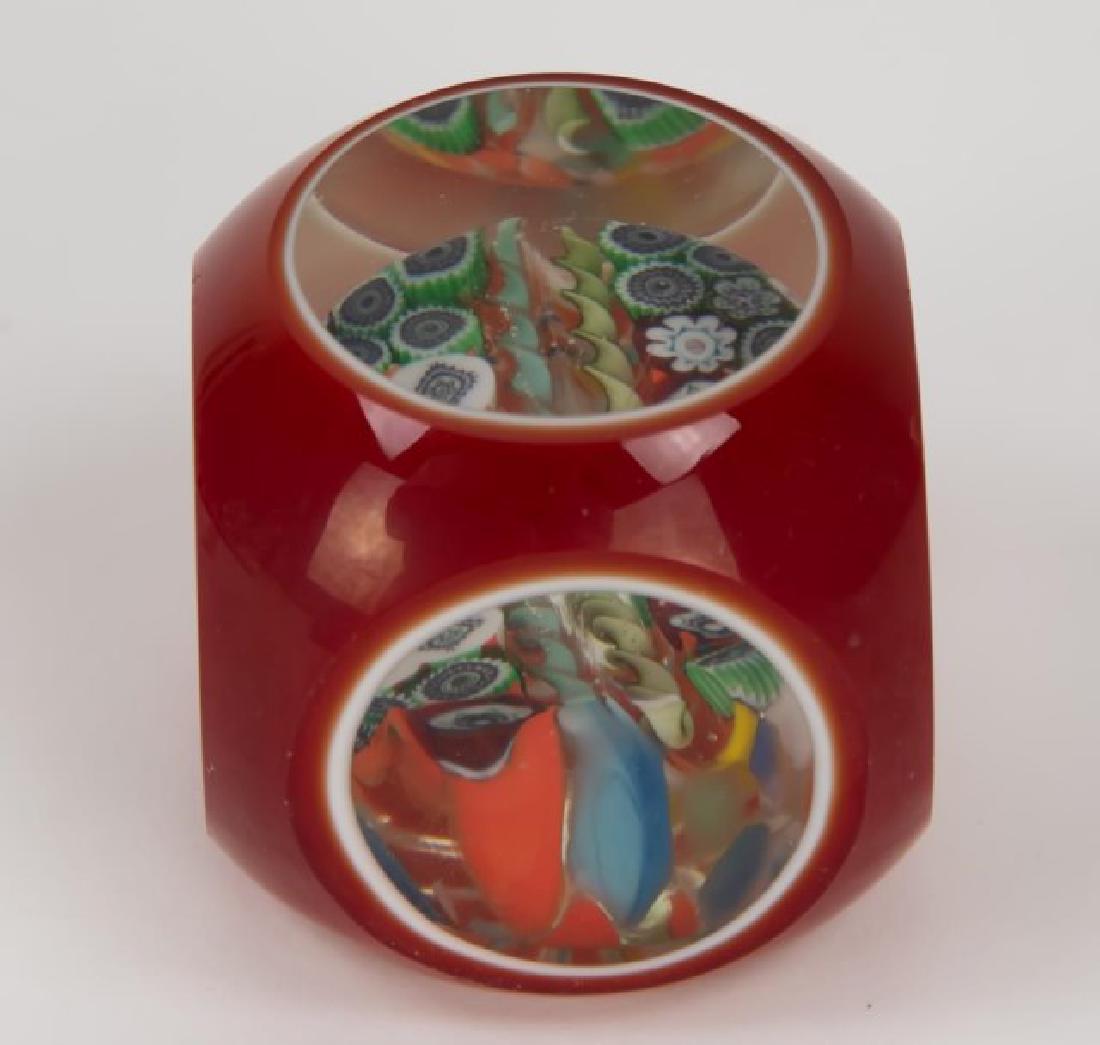 Baccarat Double Overlay Paperweight: Millefiori and ribbon center in a red and white double overlay faceted paperweight, acid stamped on polished base; approx. 2 1/4" x 2 1/4", 2 1/8"H; scattered minute flea bites to facet cut edges (Ref