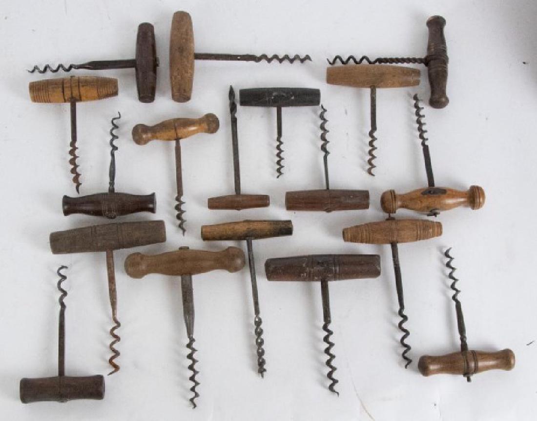 18 Corkscrews with Wooden Handles: Various turnings; 3 5/8"L - 5 5/8"L; some with minor chips and wear, scattered rust