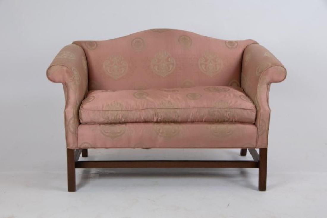 Chippendale Style Camelback Settee: Arched back and scrolled arms, square legs with stretchers, upholstery, loose down cushion, 20th century; 54"W, 30"D, 34"H, seat 20"H; some slight fraying around cording, light soiling