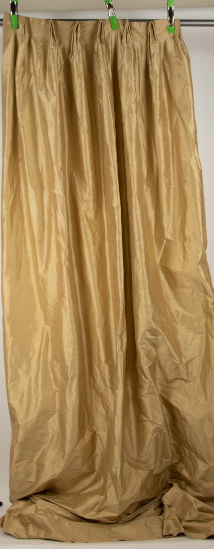 Pair of Custom Made Silk Drapery Panels: Pleated gold silk panels, lined; each approx. 32"W, 104"L; good condition with scattered spotting from insects, light soiling to hems