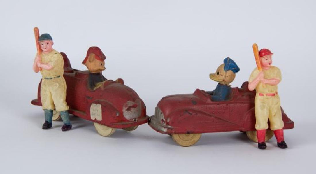 4 Toys--Sun Rubber & Occupied Japan Celluloid: 1. Mickey Mouse Fire Dept.; Sun Rubber Co., Barberton, OH; 6 1/4"L, 3 3/4"H---2. Donald Duck; Sun Rubber Co., Barberton, OH; 6 1/2"L, 3 3/4"H---3. Two celluloid baseball players, each with a bat over