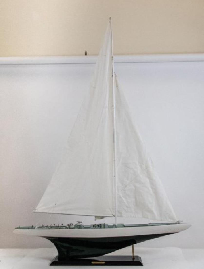 Large Model of the America's Cup "Constellation": Detailed model of the 1964 America's Cup yacht "Constellation", painted resin and wood, deck with metal and resin fittings, cloth sails; approx. 47"L, 66"H; good condition