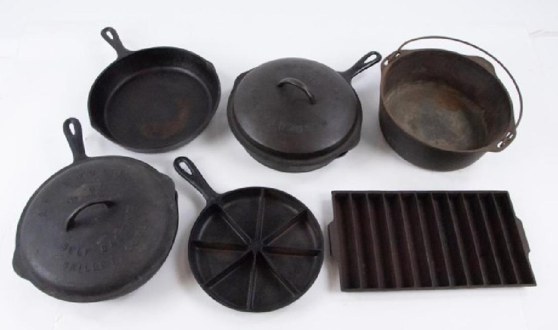 Cast Iron Skillets, Lids, Kettle: Eight pieces: 1. Griswold No. 8 Self Basting Skillet Cover---2. Wagner Drip Drop No. 8 Skillet Cover---3. Wagner Ware Sidney O skillet, 1058N---4. Lodge #88K skillet---5. Skillet, marked "Made in USA 