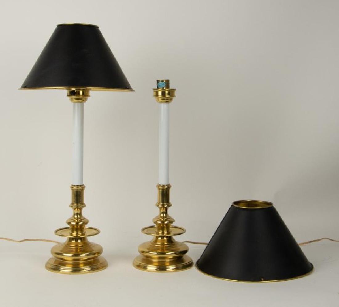 Pr. Maitland-Smith Brass Candlestick Lamps: Pair of brass candlestick style buffet or table lamps, black painted brass shades, label on base "Hand Made and Designed by Maitland-Smith Ltd."; 23"H to top of shade