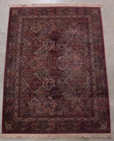 Persian Style Rug, 8'8"W x 12'7"L: Center field comprised of linked floral medallions in muted brown, teal, rust and blue; machine woven; 8'8"W x 12'7"L; good condition---From the collection of Dr. and Mrs. James Brown, formerly of Nic