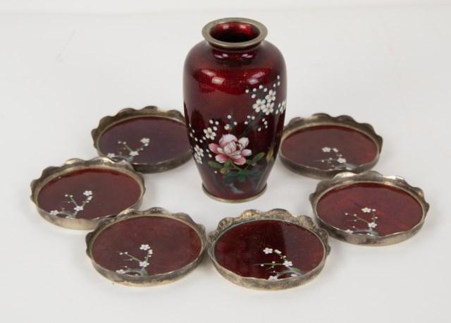 Japanese Sato Ginbari Cloisonne Vase & Coasters: Flowers including prunus branch and roses on a translucent blood-red ground, with silver foil textured ground and bamboo leaves beneath; 4 3/4"H---Set of six coasters, each having a silver metal frame