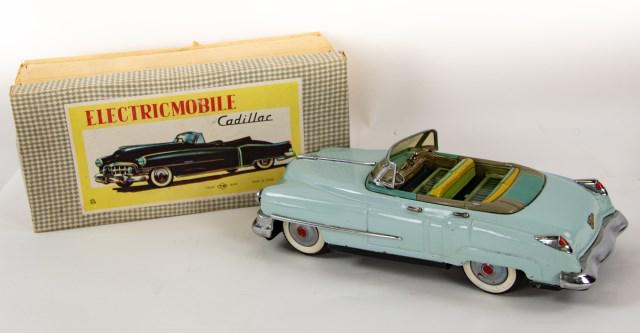 Tin Electric Mobile Cadillac Battery-Op Car: Japanese, c. 1950s, made by TN, four-door convertible in light blue, lithographed interior, includes original box, in working condition (moves forward, backward and turns; one headlight not working; e