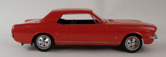 1966 Ford Mustang Wen-Mac AMF Dealer Promo: Orange plastic body with steel chassis, battery operated, opening hood and simulated V-8 engine, automobile dealer promotional; 15 1/2"L; working condition, crack to front windshield in lower right co