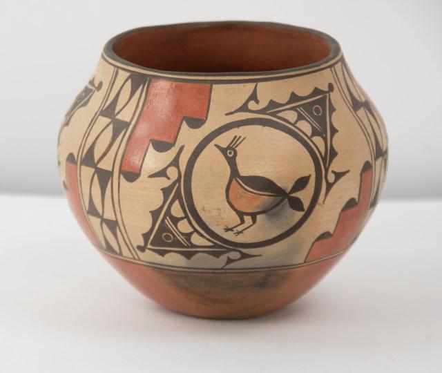 Zia Pottery Olla: Red earthenware with polychrome bird and geometric decoration; approx. 6"W, 5"H; good condition (Ref. 17)