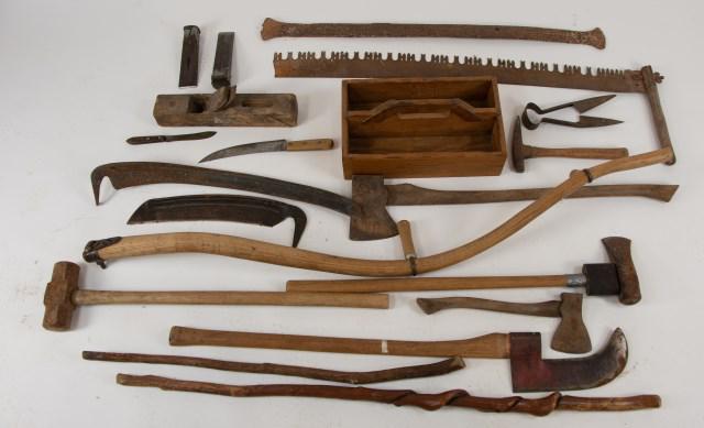 Lot of 19th and 20th Century Tools: Including: Wooden tool box, hatchet, axe, scythe with two blades, rail splitter, one-handed pick axe, saw, sledgehammer, wrought iron bar, planer, pair of metal cutters, Dexter knife, axe with curved 