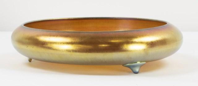 Steuben Aurene Art Glass Center Bowl: Gold Iridescent center bowl, low circular form with turned in rim and three applied feet, signed on base "Aurene 2586"; 12"W, 2 7/8"H; good condition (Ref. 08-138)