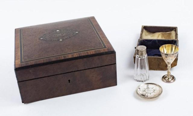 19th C. Inlaid Burlwood Box & Traveling Communion: 1. Parcel ebonized and brass inlaid burlwood jewelry box, hinged top opening to a blue tufted satin interior, center medallion on lid engraved with initials "G P", probably French; 8" x 8", 3 1/2"H; g