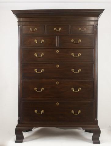 Henkel Harris, Chippendale Style Tall Chest: Mahogany, late 20th century, cove molded cornice, three over two over four graduated and cockbeaded drawers flanked by stop fluted quarter columns, ogee bracket feet, with key, label inside drawer and