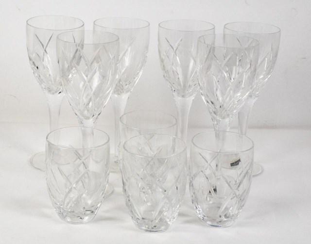 2 Sets John Rocha Waterford Cut Crystal Wines: 1. Set of six cut crystal wine glasses, two with original John Rocha / Waterford labels, all signed "John Rocha / Waterford"; 9"H; good condition---2. Set of four stemless wine glasses, each signed "J