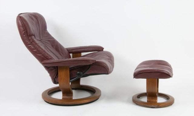 Ekornes, Stressless Leather Recliner & Ottoman: Match to following lot: Jens E. Ekornes (Norway, 1908-1976), contemporary burgundy leather chair with matching ottoman, bentwood ash frames, chair with tilting back; chair 39"H, 33 1/2"W; ottoman 19 1