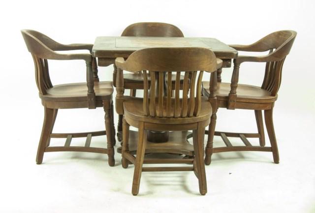 Games Table & Four Walnut Club Chairs: Games table with inlaid gameboard to center of top, supported on a turned pedestal and bun feet, mixed woods; 34" x 34", 30"H---Set of four walnut club chairs; 24 1/4"W, 32 3/4"H, 21 3/4"D, seat 18 1/