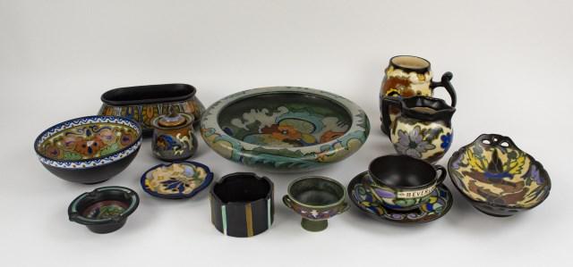 13 Pcs. Gouda & Related Art Pottery: Most pieces marked for Gouda on base: Round bowl, 10 1/4" dia., 2 3/4"H---Oval bowl, 7 3/8" x 4 1/4", 2 5/8"H---4"H pitcher---Round bowl, 5 7/8" dia., 2 1/2"H---Small footed bowl with double handles,