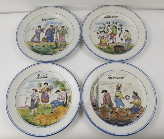 Italian Four Season Chargers, Signed Bassano: Set of four painted Italian ceramic chargers, each representing one of the four seasons: "Autunno", "Estate", "Inverno" and "Primavera"; each signed on the back "Bassano", two with foil labels from Ri