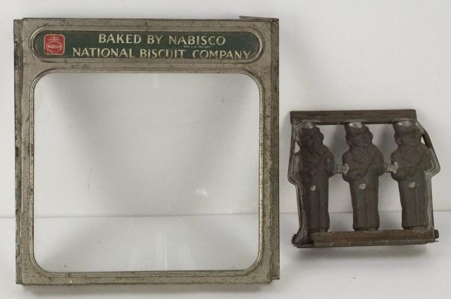 Anton Reiche German Chocolate Mold & Natl Biscuit: Hinged metal triple chocolate mold with man wearing a bowler hat and playing a violin, marked "31509" and "Anton Reiche Dresden"; 6 3/8"W, 5 7/8"H; some corrosion---National Biscuit Company metal lid