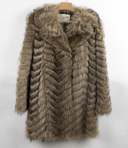 Raccoon Mid-Length Fur Coat: Label "The Aug. W. Smith Co., Spartanburg, S.C.", notched lapel collar, two front hooks, fully lined, leather sash belt; approximate size 8-10 (Ref. 293)