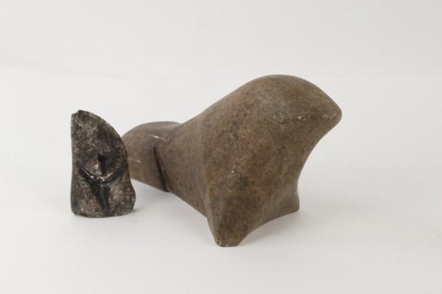 Two Inuit Carvings: 1. Stone carving of a large seal, signed by artist on base; 10"L, 5 1/2"H, 4"W; surface scratches---2. Abstract soapstone carving; 4"H, 2 1/4"W, 5/8"D; chips to edges (Ref. 11, 160)