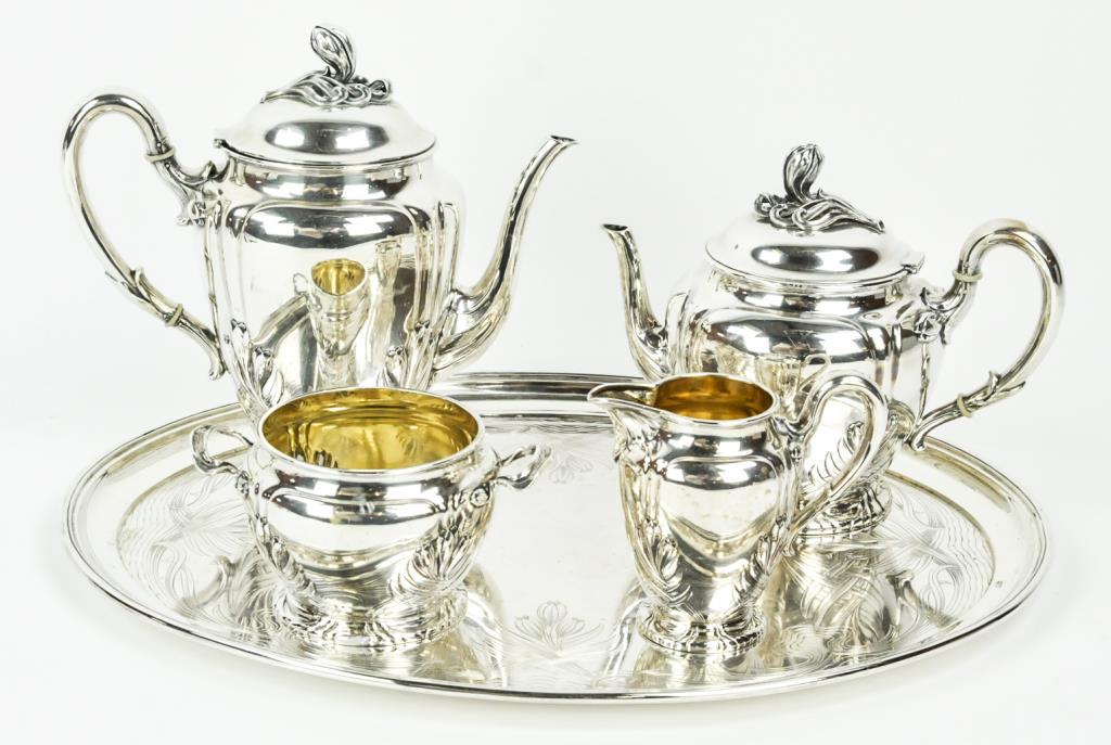 800 Silver Art Nouveau Tea & Coffee Set w/ Tray: Five-piece 800 German silver tea and coffee set and matching tray; set comprised of coffee pot, teapot, creamer, sugar bowl and tray; each with Art Nouveau floral and foliate decoration; coffee and te