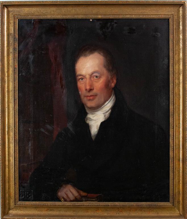 19th Century Portrait, Oil on Canvas: Portrait of gentleman wearing a black jacket and seated against a red drape, holding a book in his right hand and with a stack of books at his right elbow, pinkie ring on right hand; lower left corner