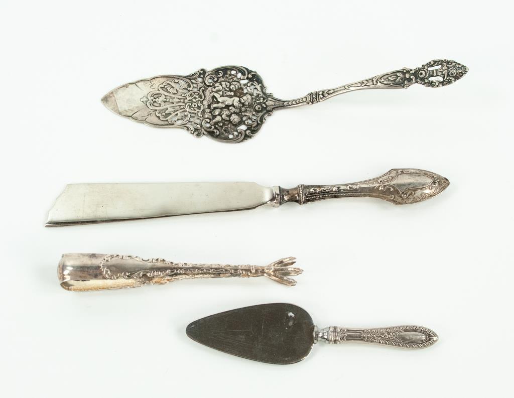Four Sterling Silver Serving Pieces: 1. Pair of 5 5/8"L sugar tongs in the Louis XV pattern by Whiting Mfg. Co., monogram---2. Pierced .800 silver pie server, decorated with putti and scrolls, handle with urn of flowers; 9 1/4"L---3. Cas