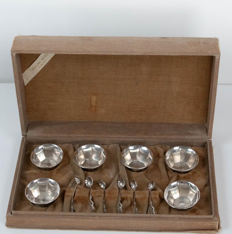 Cased G. H. French Sterling Silver Salts & Spoons: Set of six individual sterling open salt cellars with spoons, round cellars with paneled tapering sides, spoons with openwork handles, each piece marked "Sterling GHF", in a cloth and velvet lined fit