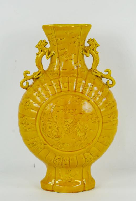 Chinese Yellow Glaze Moon Vase w/ Dragon Handles: Chinese yellow glaze porcelain moon flask vase, molded body with applied dragon handles, base with Hongzhi mark, 20th century; 14"H, 8 1/2"W; good condition (Ref. 104)