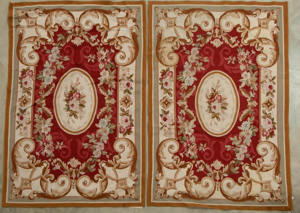 Pr. French Accents Aubusson Style Wool Area Rugs: Pair of hand crafted wool rugs in the 18th century style of Aubusson, France; label verso for French Accents Rugs and Tapestries, Inc., describing techniques used; classic design of florals and scroll