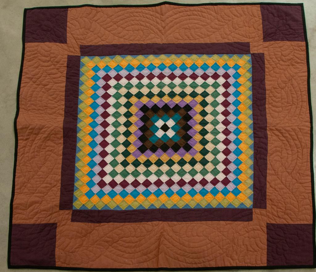 Amish Sunshine and Shadow Crib Quilt: Cotton pieced crib quilt or wall hanging with slate blue cotton back, handwritten price tag attached stating "Wall Amish Sunshine & Shadows Â© by Millie", 20th century; 40" x 40"; very good conditio